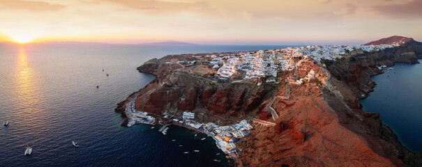 Panorama of Santorini island during sunset time with the village Oia on the edge of the caldera and...