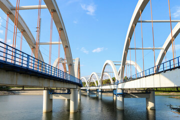 Obraz premium DABROWKA ,POLAND - JUNE 01, 2021: Bridges - railway and car ones on Lake Mucharskie,