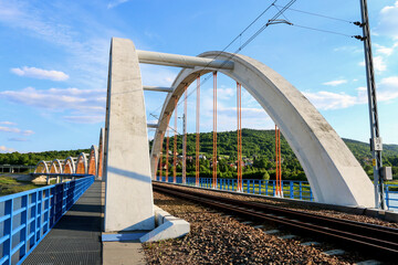 Obraz na płótnie Canvas DABROWKA ,POLAND - JUNE 01, 2021: Bridges - railway and car ones on Lake Mucharskie,