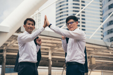 Businessman showing unity with their hands together