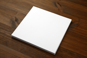 Stack of blank paper sheets on wooden table. Brochure design
