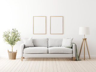 Vertical poster mockup with two frames in living room interior with grey sofa, pillows, throw, green olive tree in wicker basket and floor lamp on empty wall background. 3D rendering, illustration