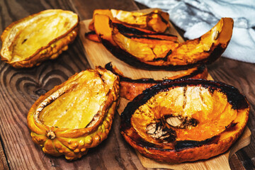 slices of sweet baked pumpkin until crispy on a wooden table