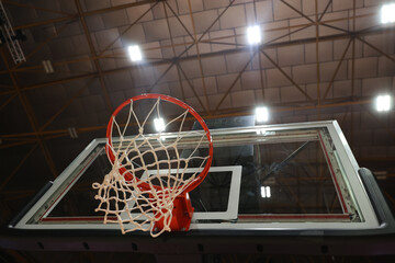 Basketball hoop in the gym. Selective focus in the center of the photo