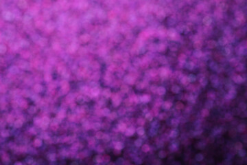 Shiny purple background with magical bokeh effect