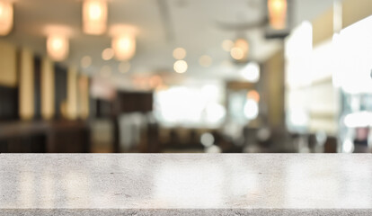 Fototapeta na wymiar Empty white marble stone table top and blur interior cafe and restaurant.