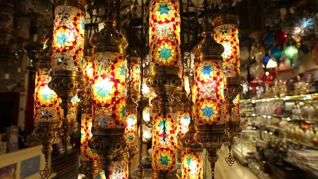 luminous turkish pattern lamps and chandeliers hanging in the store for sale