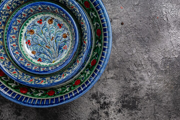 Ethnic Uzbek decorative ceramic plates and bowl with traditional national floral uzbekistan ornament