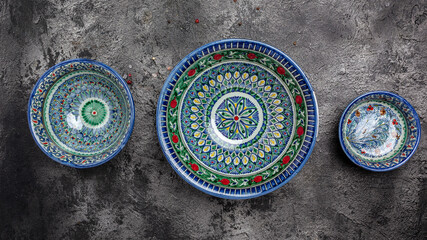 Ethnic Uzbek decorative ceramic plates and bowl with traditional national floral uzbekistan ornament