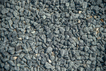 Here gray pebble gravel, to a construction site