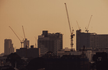Sunset in the city construction work in developing countries warm contrast.  