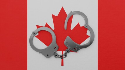 A half opened steel handcuff in center on top of the national flag of Canada