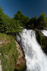 Naklejka na ściany i meble Splashing water at the incredible rhine falls in Switzerland 28.5.2021