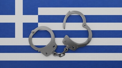 A half opened steel handcuff in center on top of the national flag of Greece