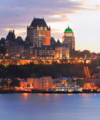Quebec City skyline at dusk with Saint Lawrence River on the foreground, Canada