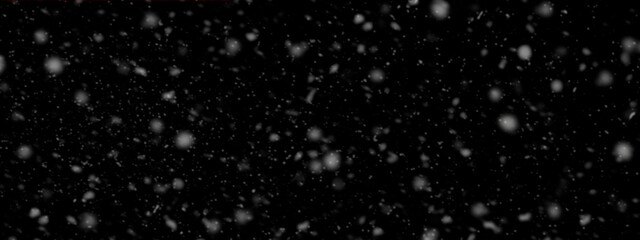Falling snow on black background stock photo