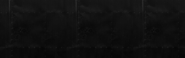 Panorama of Antique Black iron door wall with rivets pattern and background seamless