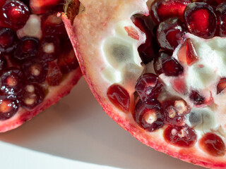 Ripe pomegranate on a white background.