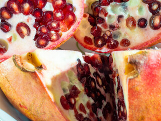 Ripe pomegranate on a white background.
