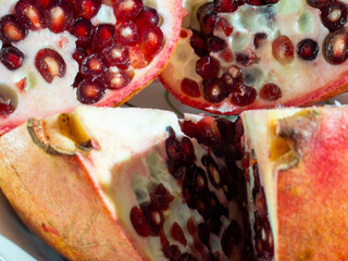 Ripe pomegranate on a white background.