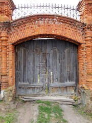 Fototapeta na wymiar Ancient door in the brick wall