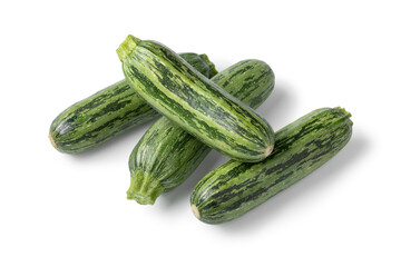 Heap of fresh raw green spotted courgette close up isolated on white background 