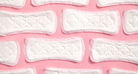 Menstrual pad on a pink background.