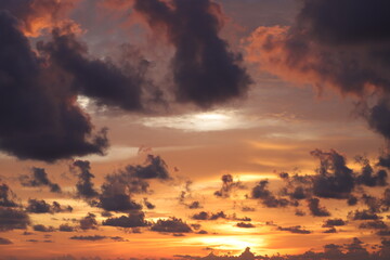 dark clouds on the glowing sky at sunset. dramatic nature scenery on the windy weather in evening.Beautiful sunset above the sea.Dramatic sunset and sunrise sky.Fiery orange sunset sky. Beautiful sky.