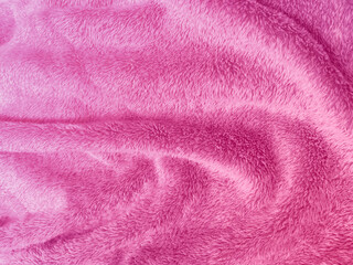 Obraz na płótnie Canvas pink clean wool texture background. light natural sheep wool. pink seamless cotton. texture of fluffy fur for designers. close-up fragment pink wool carpet.