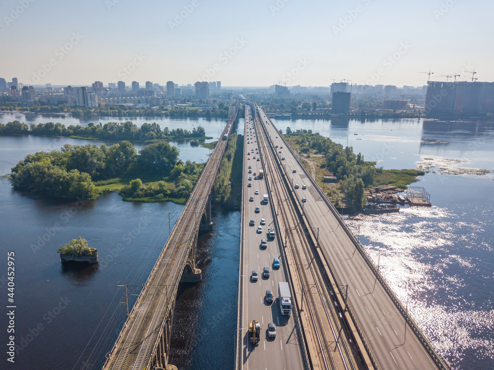 Wall mural darnitsky bridge in kiev in sunny weather. aerial drone view.