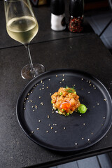 Salmon tartare with avocado, spring onion,tomato and caviar