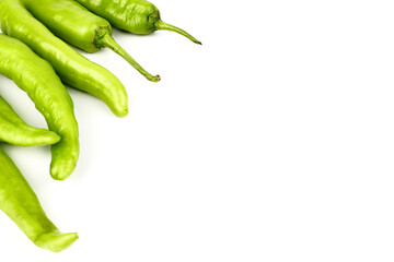 fresh green banana peppers or sweet peppers (capsicum annuum) isolated on a white background