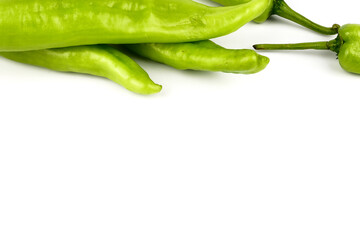 fresh green banana peppers or sweet peppers (capsicum annuum) isolated on a white background