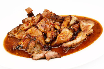 Assorted delicious Grilled pork and spicy sauce on a white plate isolated on white background