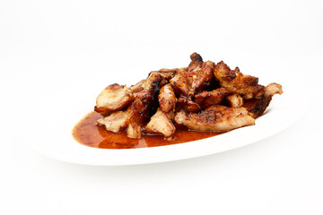 Assorted delicious Grilled pork and spicy sauce on a white plate isolated on white background
