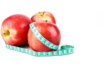 Close Up Red Apple with Measuring Meter tape for the healthy diet and slimming. isolated on white background. lose weight concept