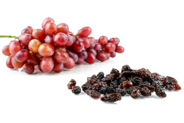 Black sweet Raisins or dried sweet grapes (kali kishmish or Zante currant) isolated on white background