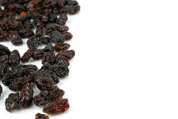Black sweet Raisins or dried sweet grapes (kali kishmish or Zante currant) isolated on white background
