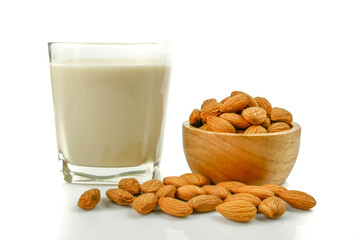 almond kernel and almond milk in the glass isolated on white background
