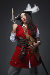 Dangerous female corsair with wavy hairs wearing costume