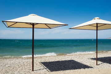 Beach umbrella on the Black Sea coast. Swimming season.