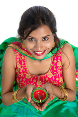 Portrait of a Indian Traditional Girl holding Diya, Girl Celebrating Diwali or Deepavali with...