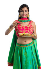 Portrait of a Indian Traditional Girl holding Diya, Girl Celebrating Diwali or Deepavali with...