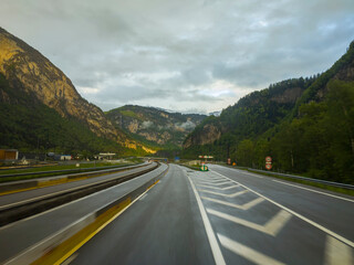 Fototapeta premium motorway with cars between mountains