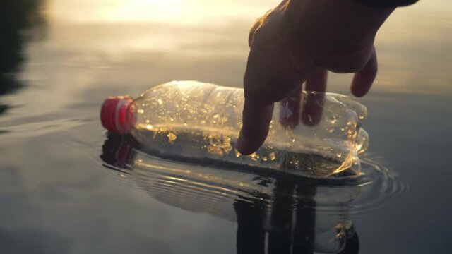 ocean cleaning programs, volunteers pick up Floating plastic debris, plastic waste crisis. plastic pollution and environmental problem concept. beach cleanups.