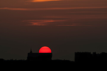 Fototapeta na wymiar Sunset over the city. Poland Bialystok. The photo was taken against the sun