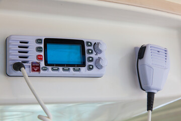 Walkie-talkie in the control cabin of a motor yacht. Radio station on a yacht.