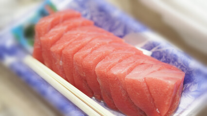 Tuna sashimi. Otoro sashimi ready to eat on plate from famous shop in supermarket Osaka Japan. Best part of Tuna is called Otoro which come from tuna fatty belly. Very popular menu for sushi lovers.