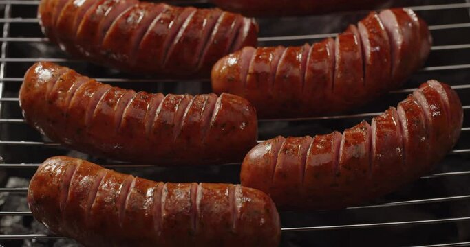 Barbecue. Grilled sausages. Hot dog sausage cooked on an open grill. Picnic. Studio shooting 