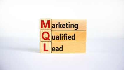 MQL marketing qualified lead symbol. Wooden blocks with words 'MQL marketing qualified lead'. Beautiful white background. Business and MQL marketing qualified lead concept. Copy space.